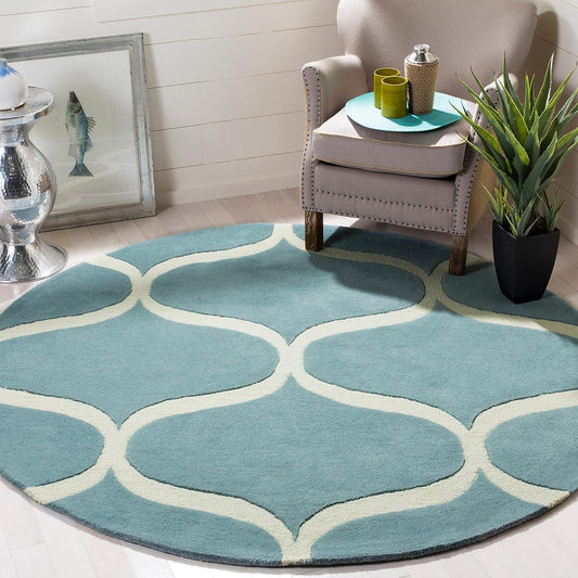 Round hand tufted carpet placed under a centre table