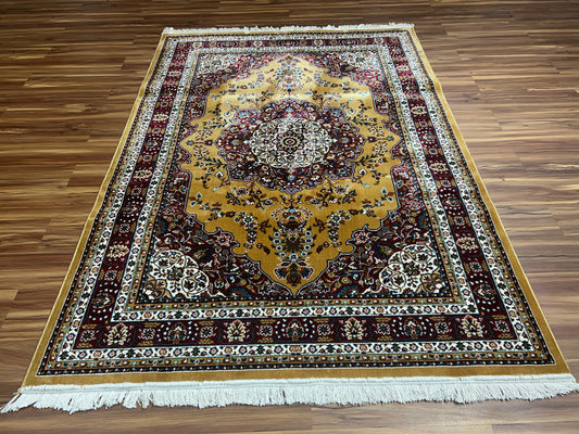 Large wool rug in a living room with the sofa front legs resting on it